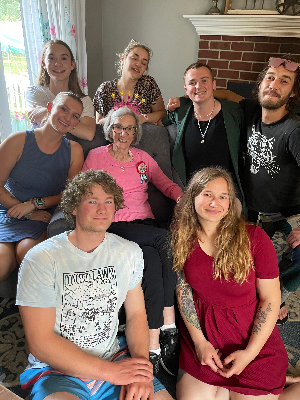 Mom celebrating with her 7 grandchildren