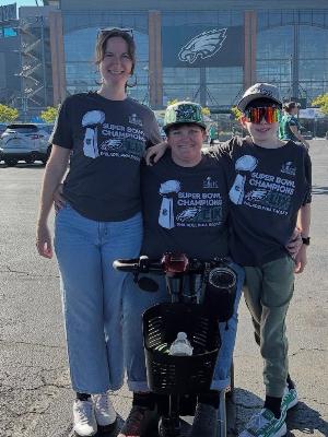 Margit and her family celebrating her being named an "Eagles All-Pro Teacher"